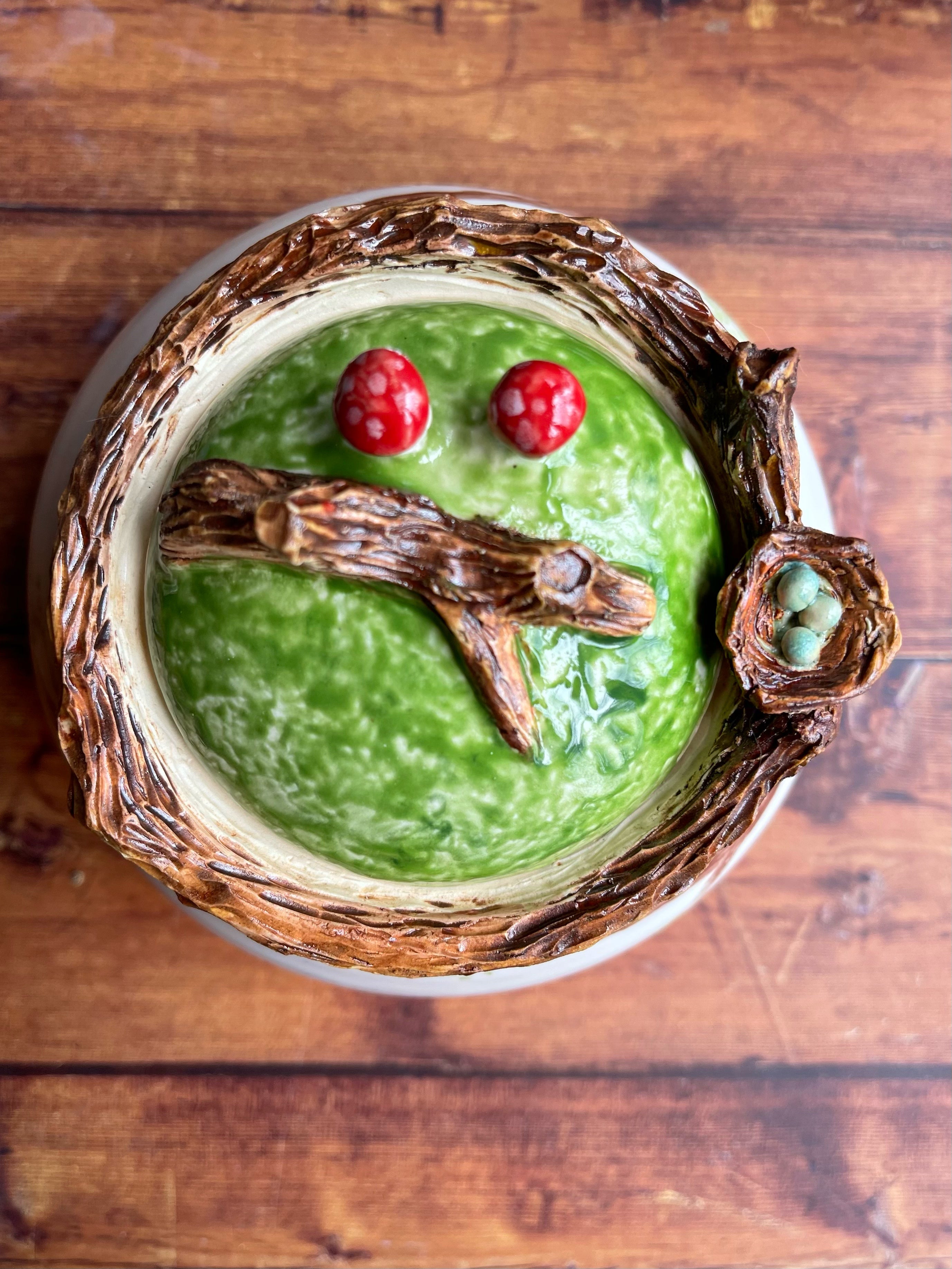 Ceramic jar with bird’s nest