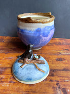 Handmade ceramic jar with a raven’s nest