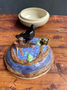 Ceramic raven and her nest