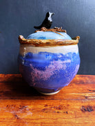 Ceramic handmade jar with a raven and nest