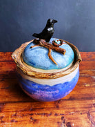 Raven’s nest sculpted ceramic jar