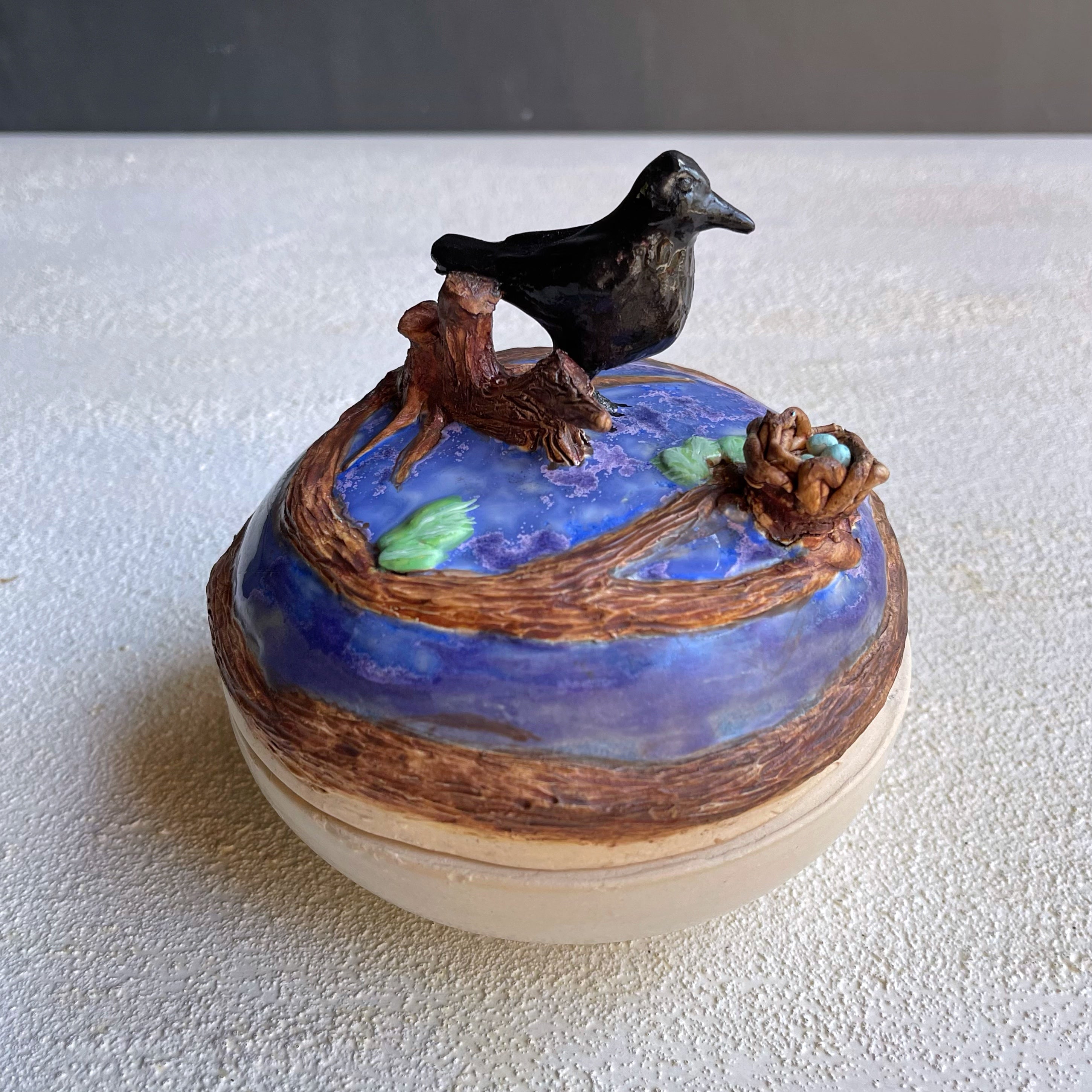 Ceramic box with raven